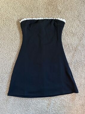 Princess Polly Strapless Black Dress with White Ruffle Neckline.